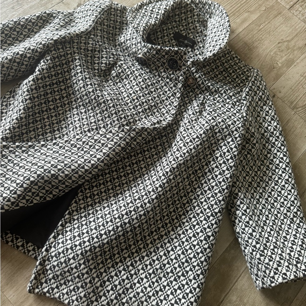 This black and grey, turtleneck coat in a size small.